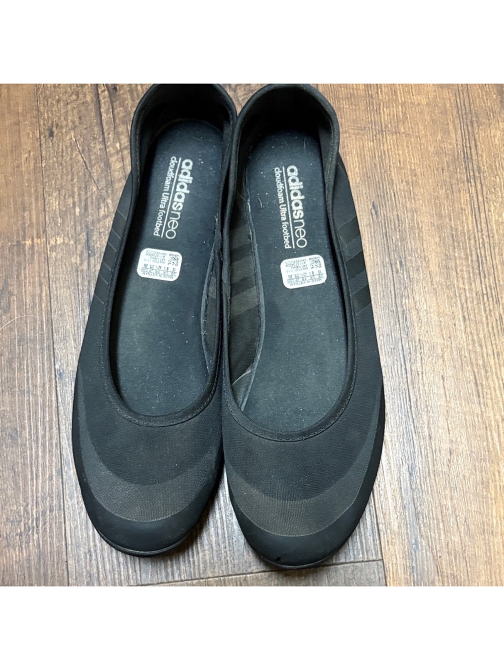 adidas black slip-on ballet flats with subtle three-stripe detail